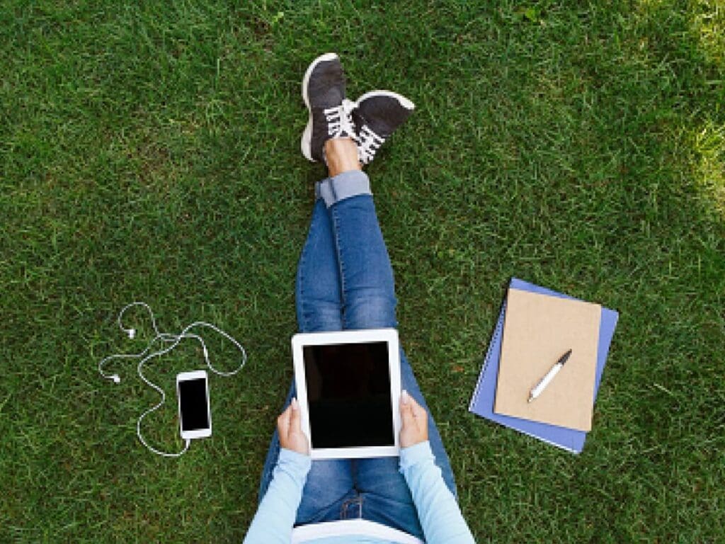 Student working in grass