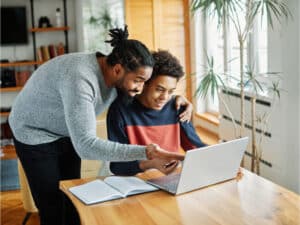 Student and parent learning virtually