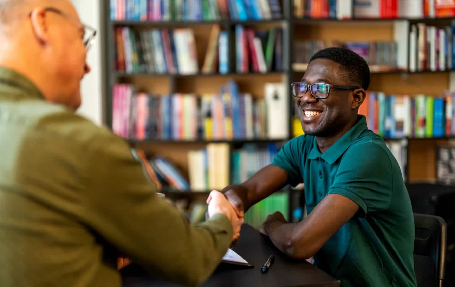 Student and college faculty in an interview