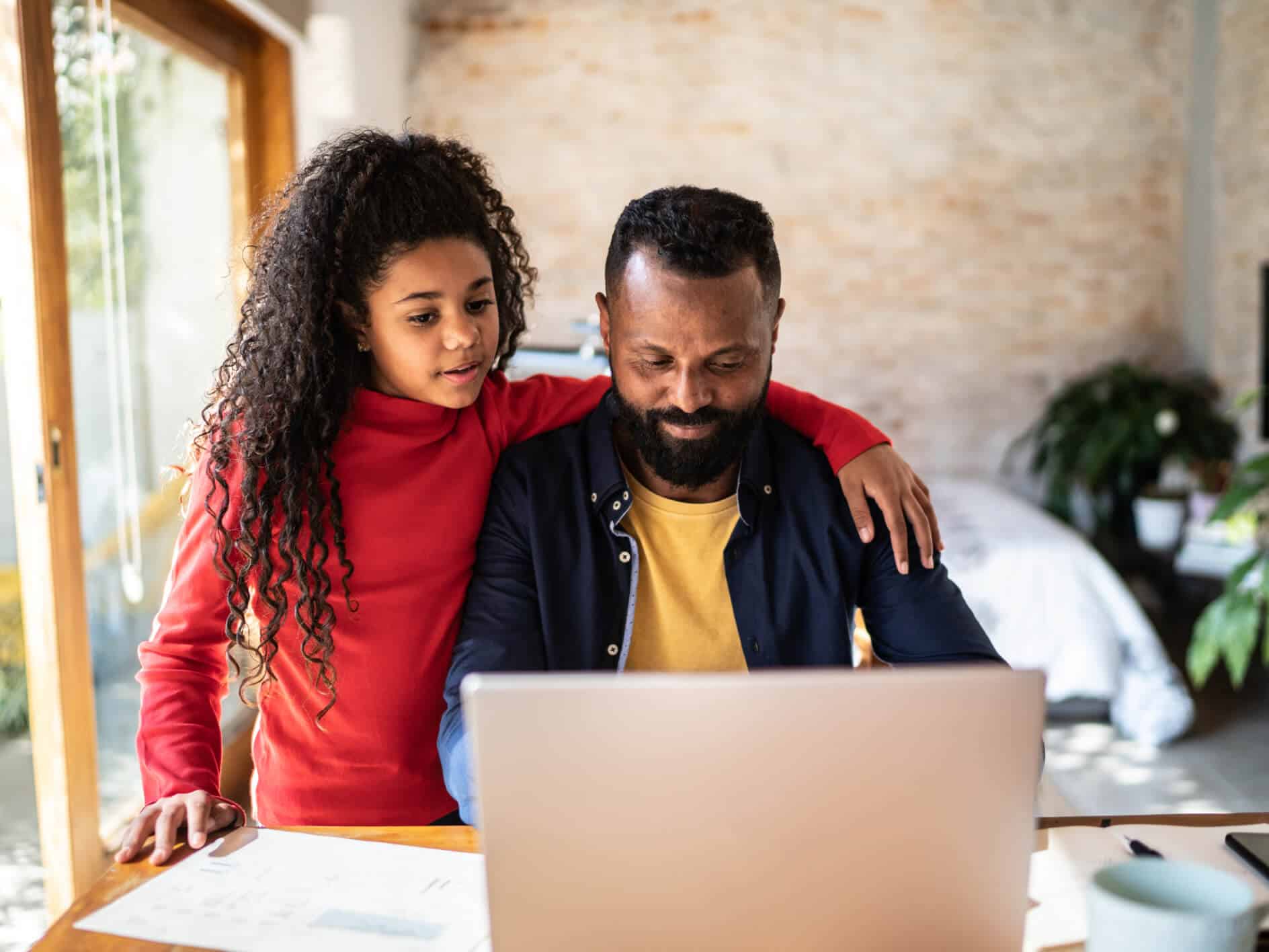 Student and parent working online