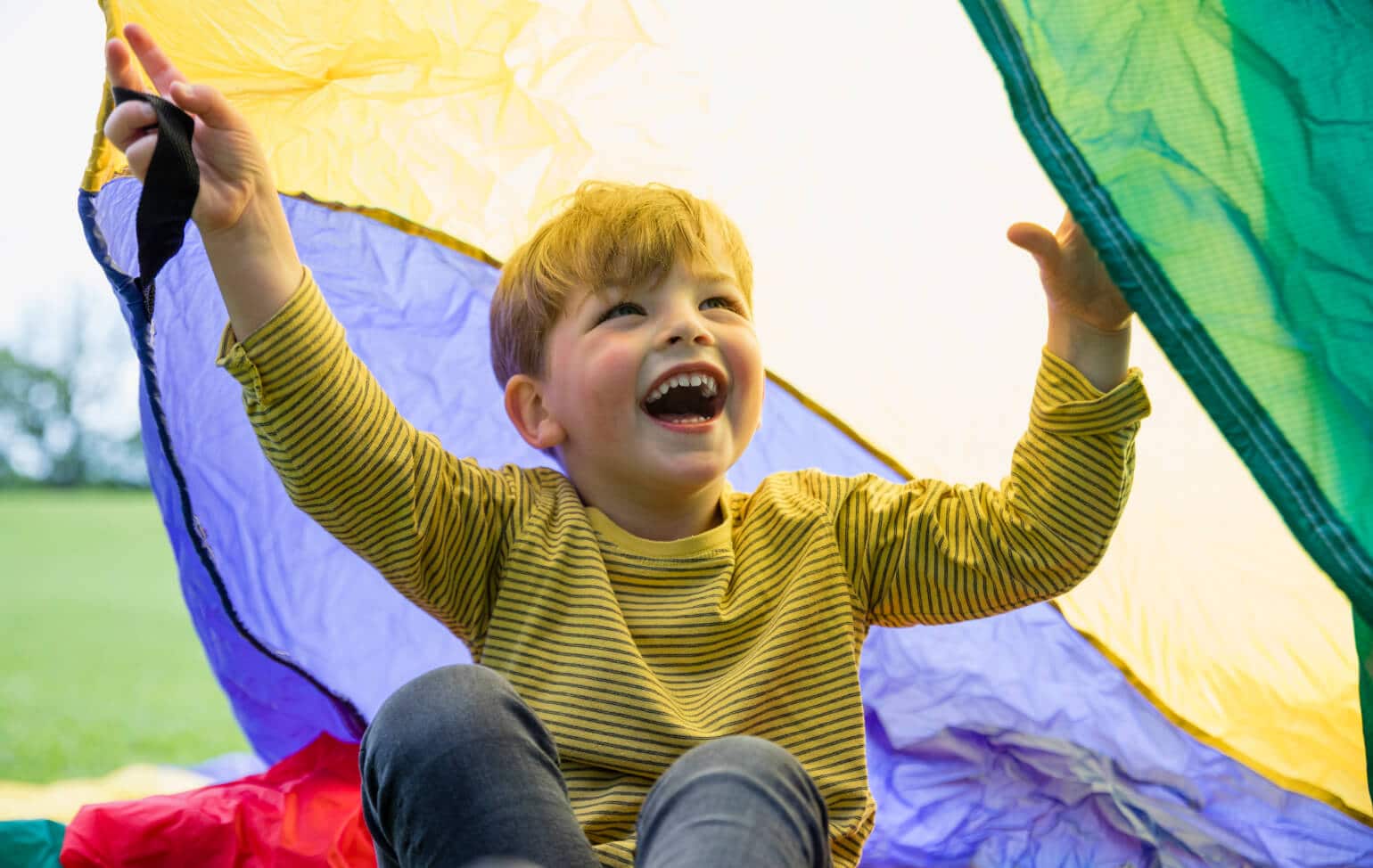 Preschool student playing outside