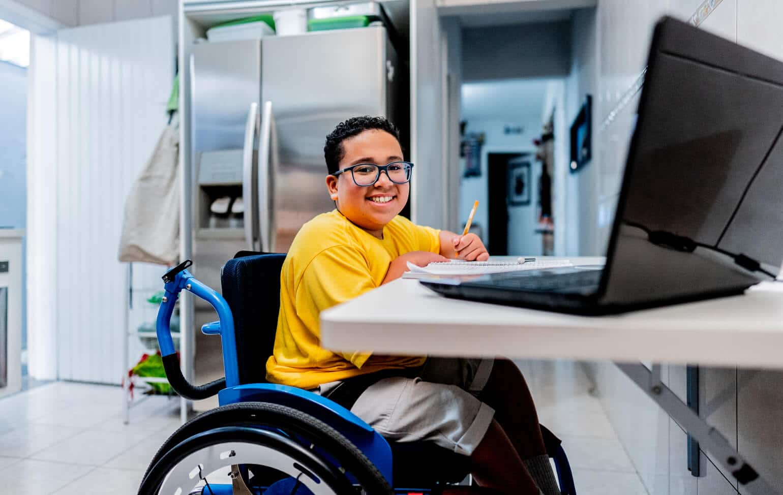 Student in wheelchair learning online